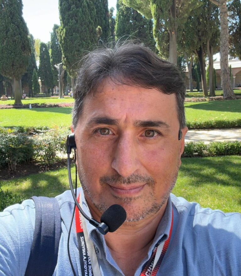 a man wearing sunglasses taking a selfie