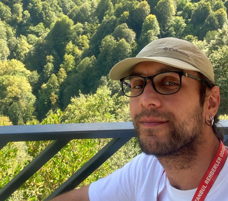 a man wearing a hat and glasses
