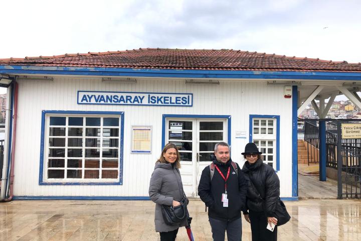 a man and a woman standing in front of a building