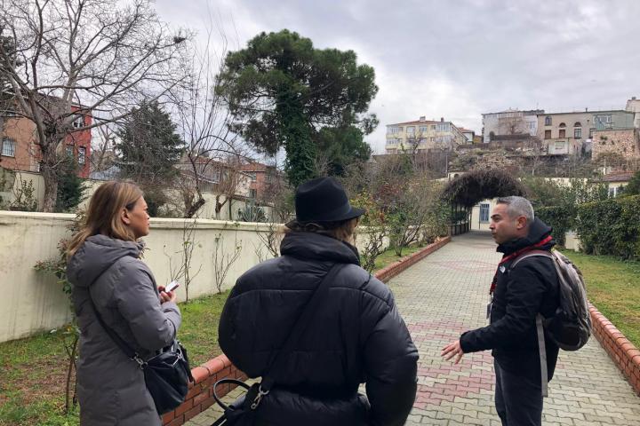 a couple of people that are standing in the grass