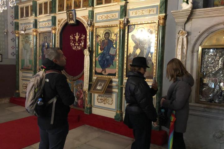 a group of people standing in front of a building