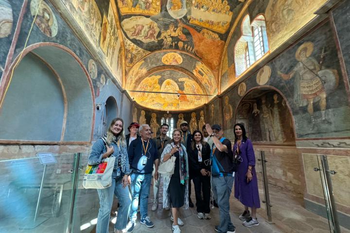 a group of people standing in front of a building