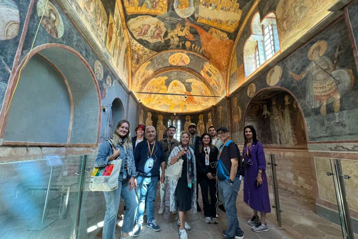 a group of people standing in front of a building