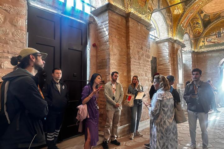 a group of people standing in front of a building