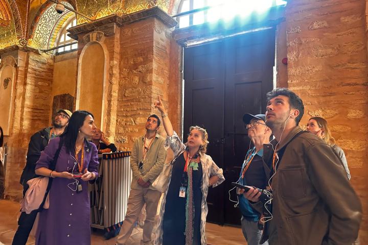 a group of people standing in front of a building