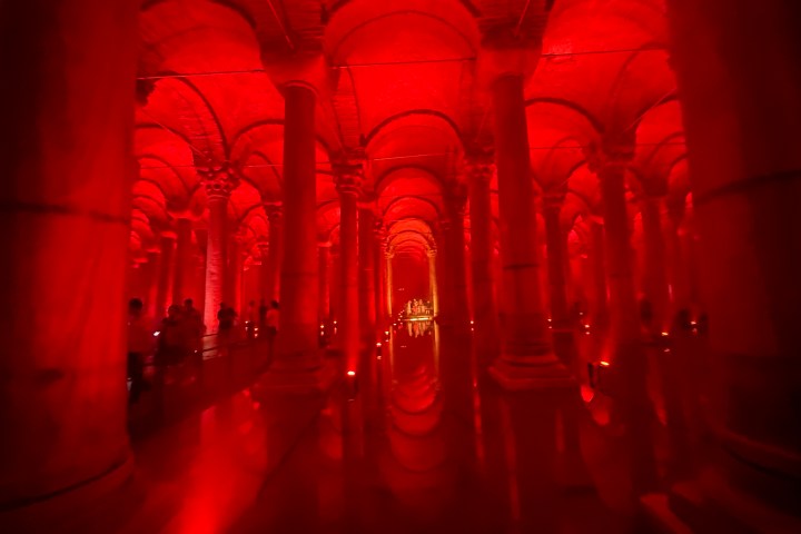 a large building with Basilica Cistern in the background