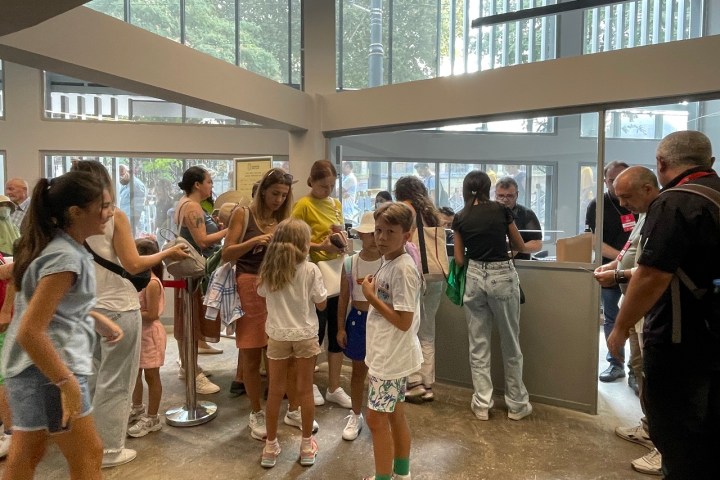 a group of people standing in front of a building