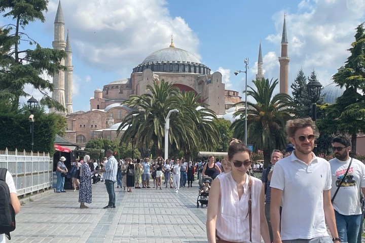 a group of people standing in front of a building