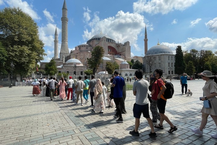 a group of people standing in front of a crowd