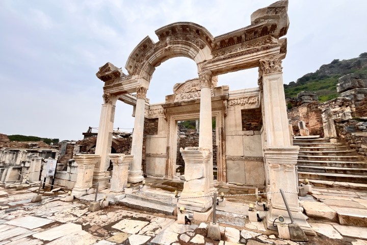 a large stone statue in front of a building