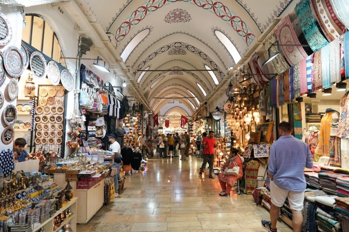 a group of people in a store with Grand Bazaar, Istanbul in the background